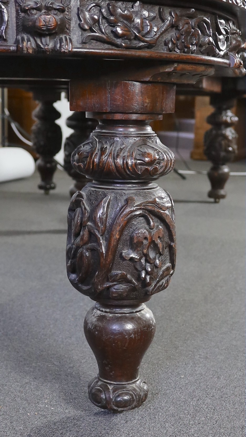 A late Victorian carved oak extending dining table, 178 x 142cm, extends to 356cm H.75cm